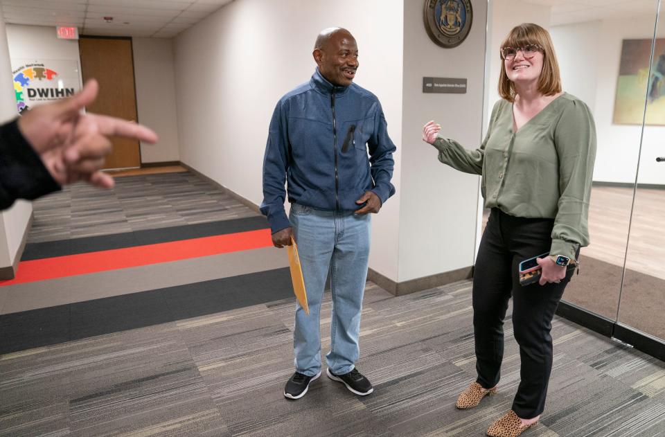 Albert Garrett, 60, left, who was recently released from prison after serving 44 years, bumps into his appointed attorney from 2016, Lindsay Ponce, an assistant defender from the state of Michigan Appellate Defenders Office, on Monday, May 1, 2023.