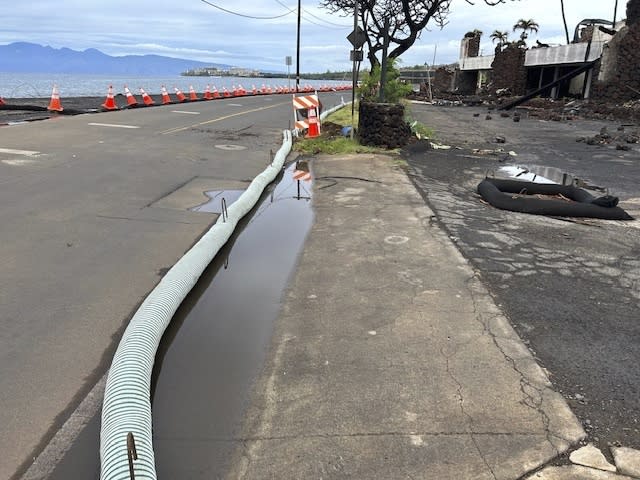 This photo provided by the County of Maui shows a storm ditch and protective barriers in Lahaina, Hawaii, on Wednesday, Nov. 29, 2023. Maui officials were on standby Wednesday, Nov. 29, 2023, to prevent ash from August's deadly wildfire in Lahaina from flowing into storm drains after forecasters said a winter storm could bring heavy rain and strong winds to the island. (Mia A'i/County of Maui via AP)