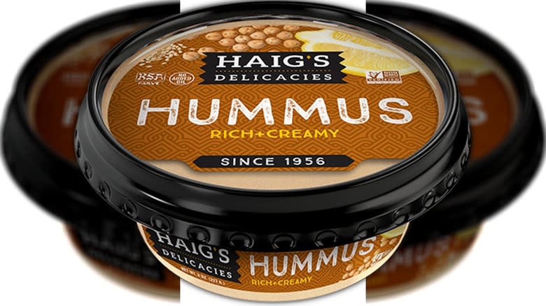 Black pot of creamy hummus