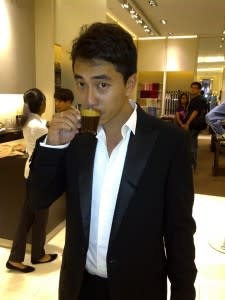 Picture of Mr. Andy Seah sipping coffee