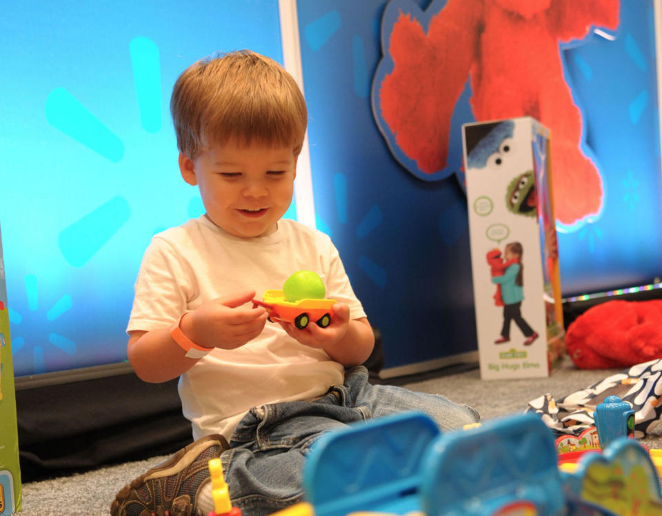 In this undated photo provided by Wal-Mart, one of about 1,000 boys and girls aged 18 months to 10 years plays with a toy as part of an event during August 2013 in Dallas. The children chose their favorites, resulting in a top 20 list of kid-approved toys. (AP Photo/Wal-Mart)