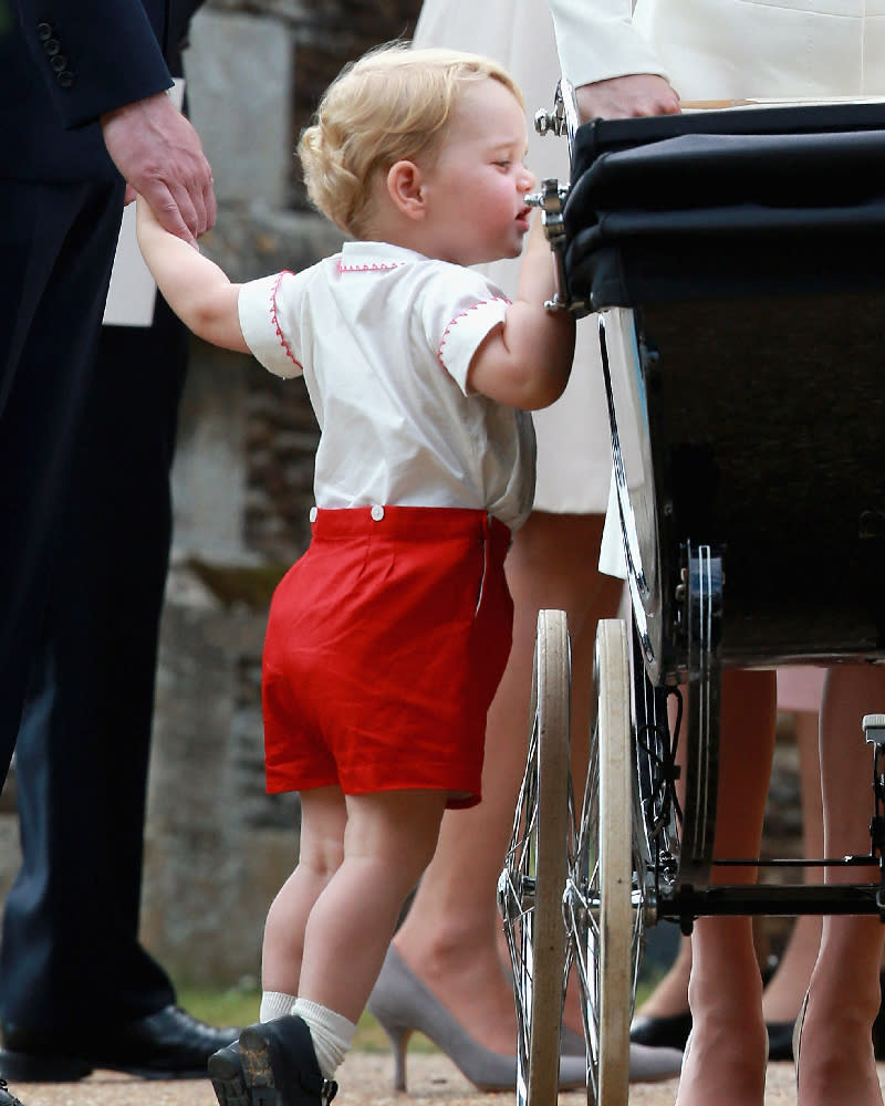 <p> In this sweet picture, we see a young Prince George already taking his brotherly duties very seriously, keeping a watchful eye over his baby sister Princess Charlotte at her christening in King's Lynn, Norfolk, back in 2015. At the time George would have only been two-years-old, standing on his tiptoes to peer over the side of her buggy.  </p>