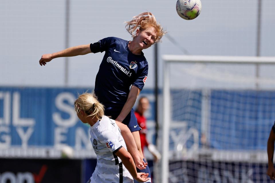 North Carolina Courage midfielder Samantha Mewis (5) gets her head on the ball against Portland Thorns FC midfielder Lindsey Horan (10) in the first half at Zions Bank Stadium on July 17, 2020.