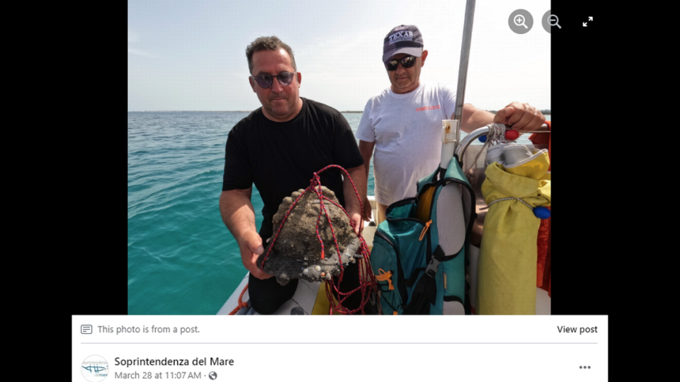 Scientific divers and researchers identified the oddly shaped rock as a medieval helmet. Screengrab from Soprintendenza del Mare's Facebook post