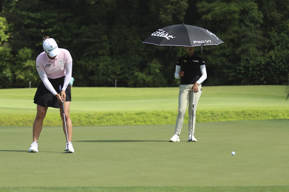 Minjee Lee of Australia plays a putt on the 11th tee during the first round of the HSBC Women's Wold Championship at the Sentosa Golf Club in Singapore Thursday, Feb. 29, 2024. (AP Photo/Danial Hakim)