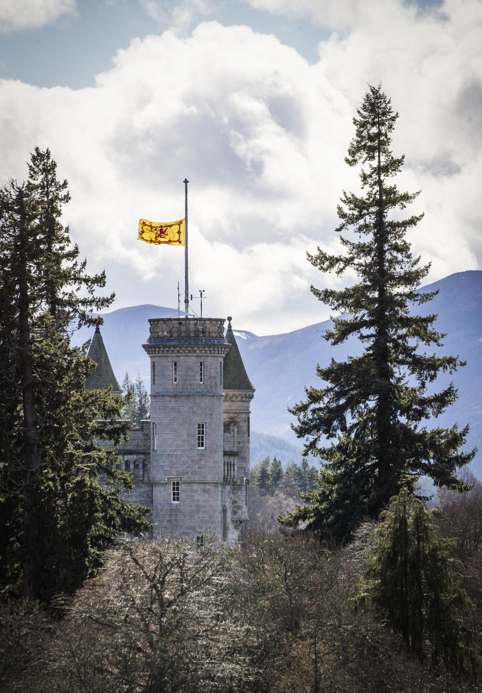 The Lion rampant flies at half mast at Balmoral Castle following the announcement of the death of Britain's Prince Philip, in Aberdeenshire, Scotland, Friday, April 9, 2021. Prince Philip, the irascible and tough-minded husband of Queen Elizabeth II who spent more than seven decades supporting his wife in a role that both defined and constricted his life, has died, Buckingham Palace said Friday. He was 99. (Jane Barlow/PA via AP)