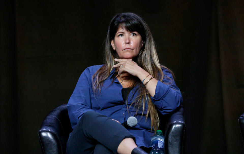 close up of Patty sitting on a panel