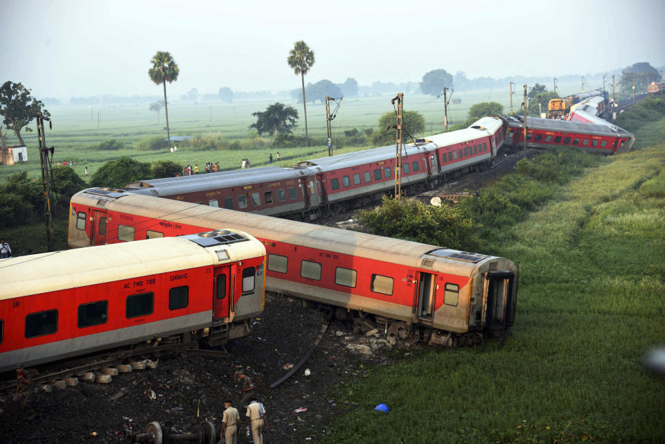 Coaches of the North-East Express passenger train that derailed late Wednesday near Raghunathpur railroad station in Buxar district of Bihar state, India, Thursday, Oct.12, 2023. The train was on its way to Assam state from New Delhi. (AP Photo/Aftab Alam Siddiqui)