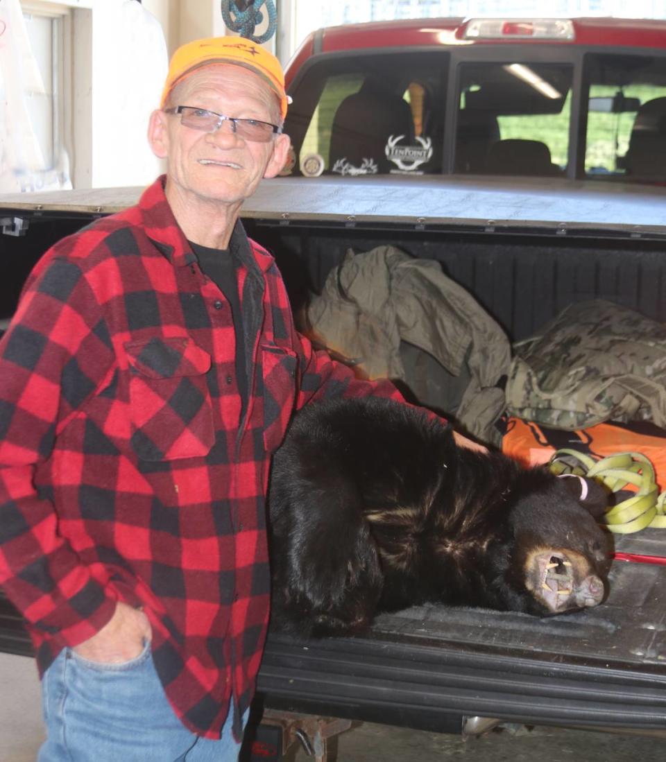 Buddy Dorman poses with the bear that he checked at the Centre County check station. Mark Nale/For the CDT