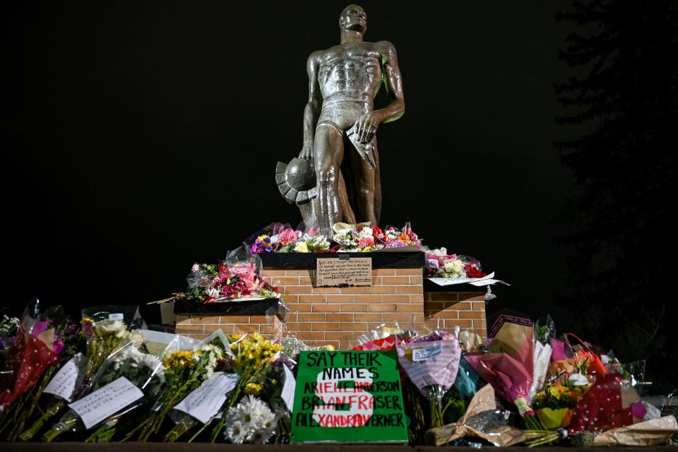 The Sparty statue surrounded by flowers in honor of the victims of Monday's mass shooting at Michigan State University on Wednesday in East Lansing.