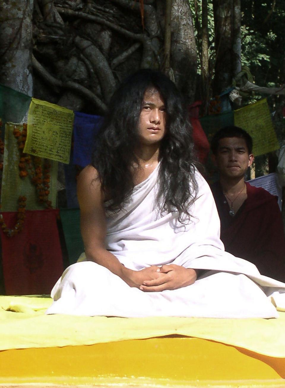 Nepali spiritual leader Ram Bahadur Bomjan, dubbed “Buddha Boy”, sits under a tree before an audience gathered to listen to his sermon in Ratanpuri (AFP/Getty Images)