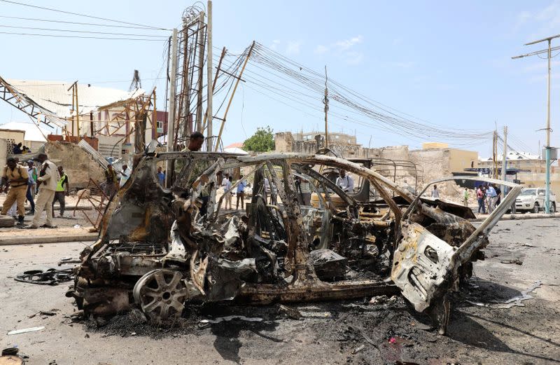 The wreckage of a car is seen at the scene of a bomb explosion at the Maka al-Mukarama street in Mogadishu