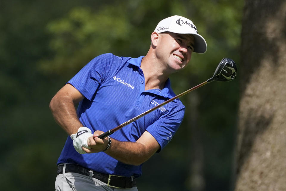 Brian Harman hits from the 12th tee during the first round of the BMW Championship golf tournament, Thursday, Aug. 27, 2020, at Olympia Fields Country Club in Olympia Fields, Ill. (AP Photo/Charles Rex Arbogast)