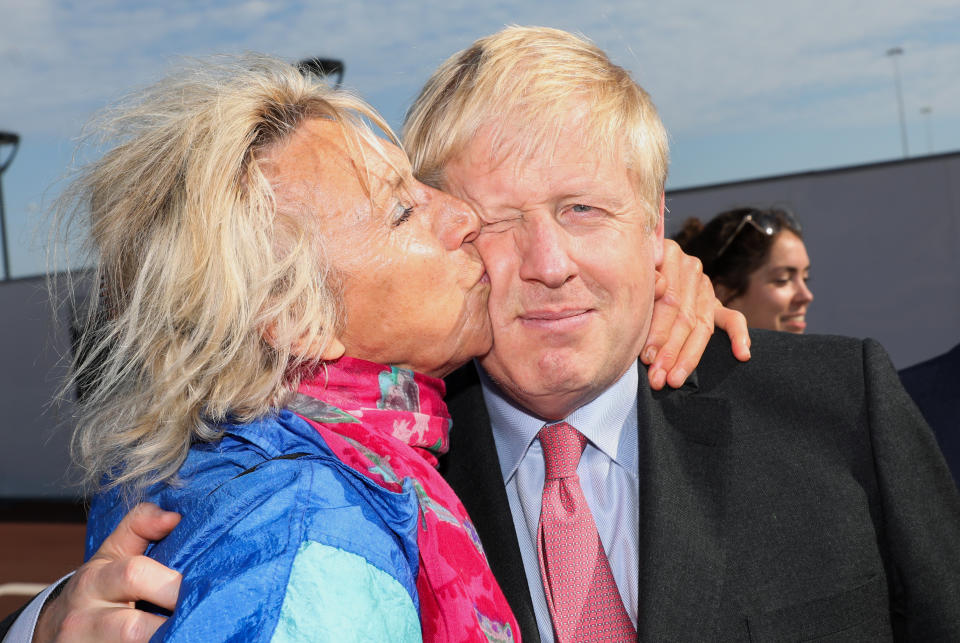 Britain's Conservative Party leadership candidate Boris Johnson, right, is greeted by a supporter during a campaign stop at the port of Dover, southeast England, Thursday July 11, 2019. The two contenders, Jeremy Hunt and Boris Johnson are competing for votes from party members, with the winner replacing Prime Minister Theresa May as party leader and Prime Minister of Britain's ruling Conservative Party. (Chris Ratcliffe/Pool via AP)