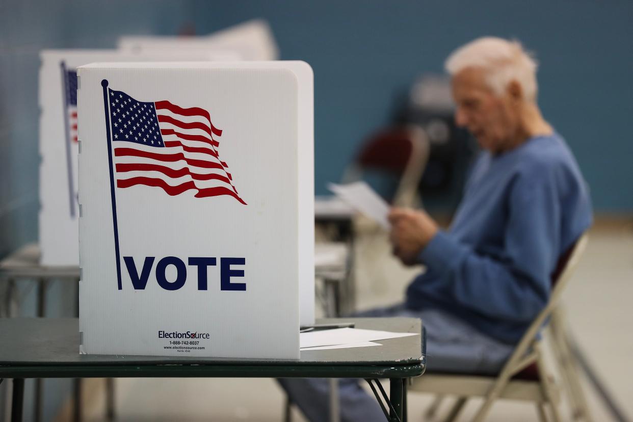 Ken Anderson looks over his ballot at the St. John Lutheran Church on Election Day in Louisville, Ky. on Nov. 7, 2023.