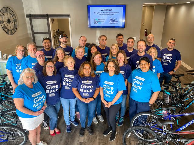 <p>Navy Federal Credit</p> Navy Federal’s Executive Development Program assembles bikes for Big Brothers Big Sisters of Northwest Florida.