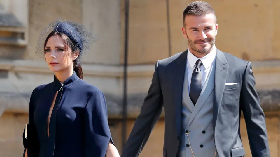 WINDSOR, UNITED KINGDOM - MAY 19: (EMBARGOED FOR PUBLICATION IN UK NEWSPAPERS UNTIL 24 HOURS AFTER CREATE DATE AND TIME) Victoria Beckham and David Beckham attend the wedding of Prince Harry to Ms Meghan Markle at St George's Chapel, Windsor Castle on May 19, 2018 in Windsor, England. Prince Henry Charles Albert David of Wales marries Ms. Meghan Markle in a service at St George's Chapel inside the grounds of Windsor Castle. Among the guests were 2200 members of the public, the royal family and Ms. Markle's Mother Doria Ragland. 