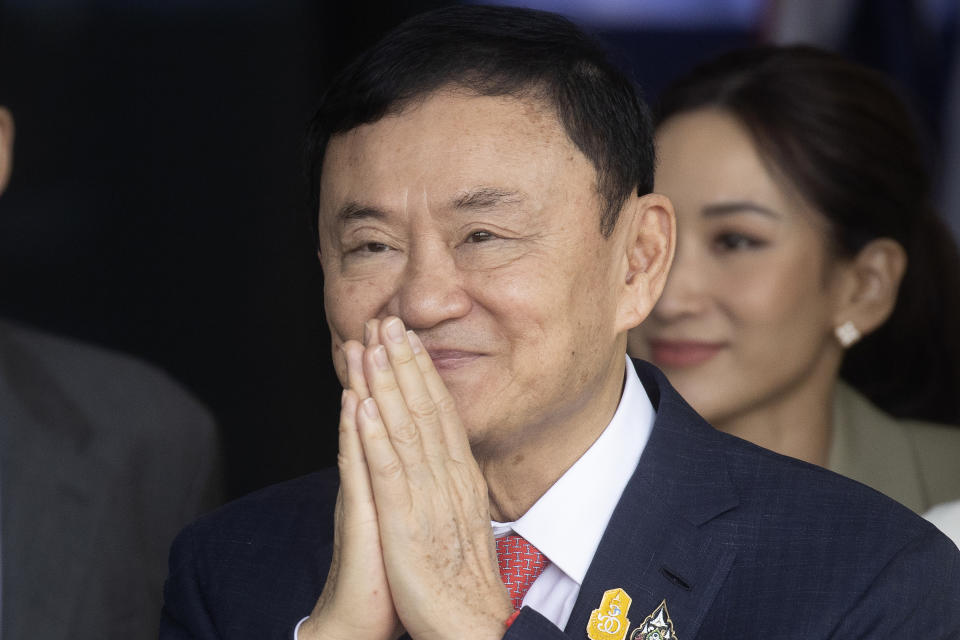 CORRECTS DATE TO TUESDAY JAN. 16. FILE - Thailand's former Prime Minister Thaksin Shinawatra greets his supporters as he arrives at Don Muang airport in Bangkok, Thailand, Tuesday, Aug. 22, 2023. Thailand's former Prime Minister Thaksin Shinawatra is a convict serving a prison sentence for wrongdoing in office, but it's not right to call him an inmate, the country's Correction Department declared Tuesday, Jan. 16, 2024. (AP Photo/Wason Wanichakorn, File)