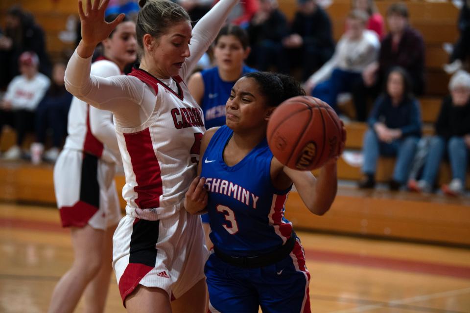 Neshaminy sophomore Alena Cofield looks to pass under pressure in PIAA girls basketball first-round game at Archbishop John Carroll High School in Radnor on Friday, March 10, 2023. Neshaminy fell to Archbishop Carroll 50-37.