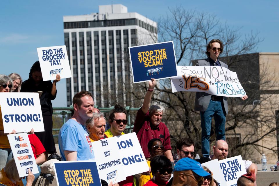 People gather to protest a school voucher bill, corporate tax loopholes and the grocery tax at the Tennessee Capitol in Nashville, Tenn., on Tuesday, March 12, 2024.