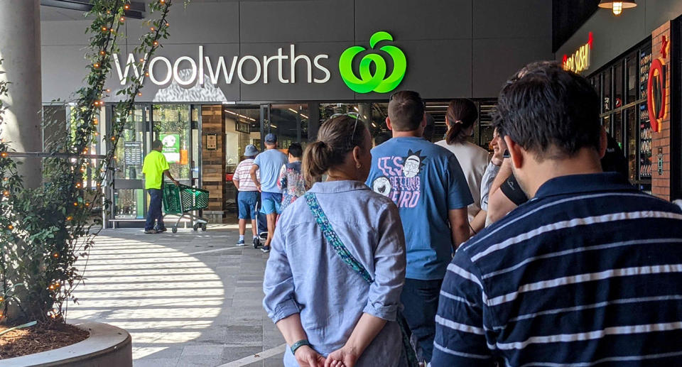 Woolworths shoppers line up outside store during pandemic. Source: AAP