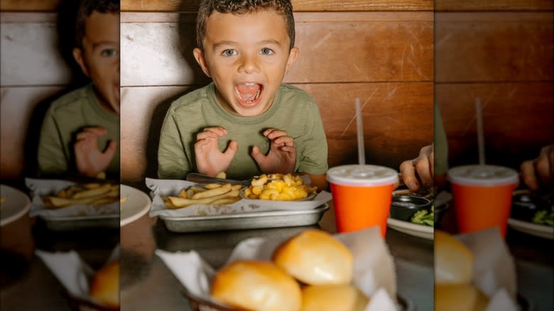 Child eating at Logan's Roadhouse 