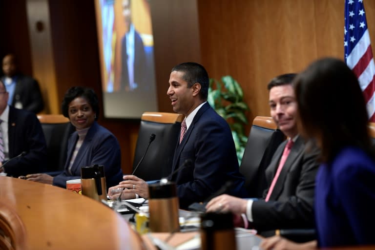 FCC chairman Ajit Pai, center, speaks during a hearing ahead of a vote by the telecom regulator on "net neutrality" rules