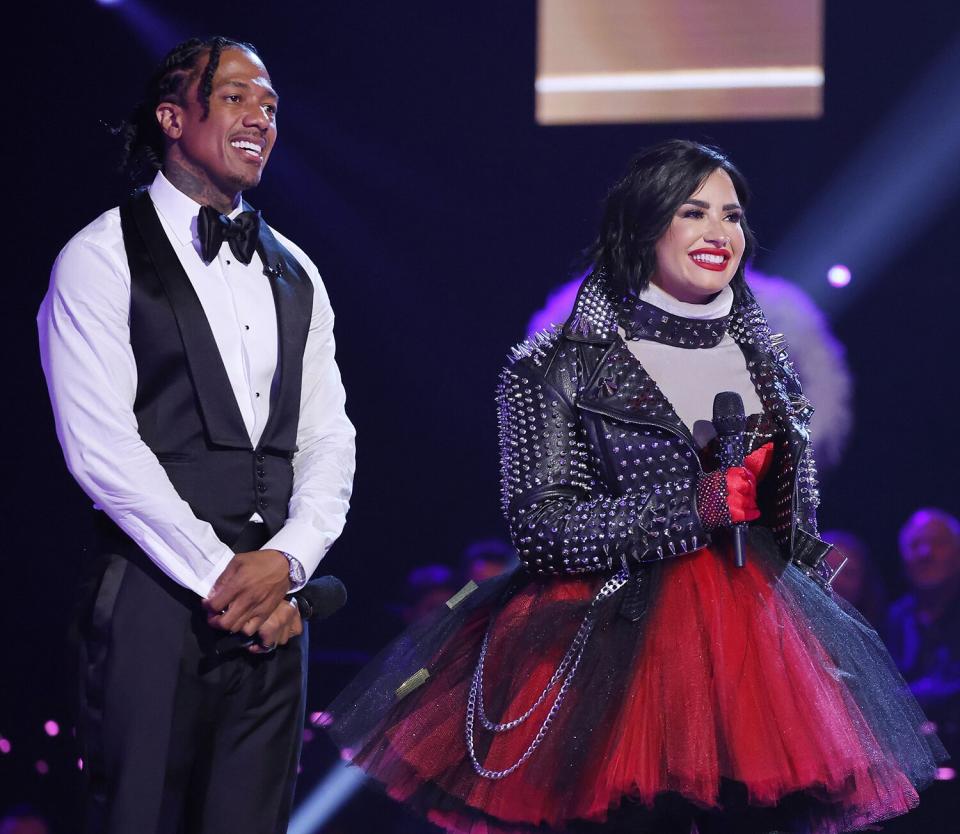 Nick Cannon and Demi Lovato in the all-new “Season 10 Kickoff” episode of THE MASKED SINGER