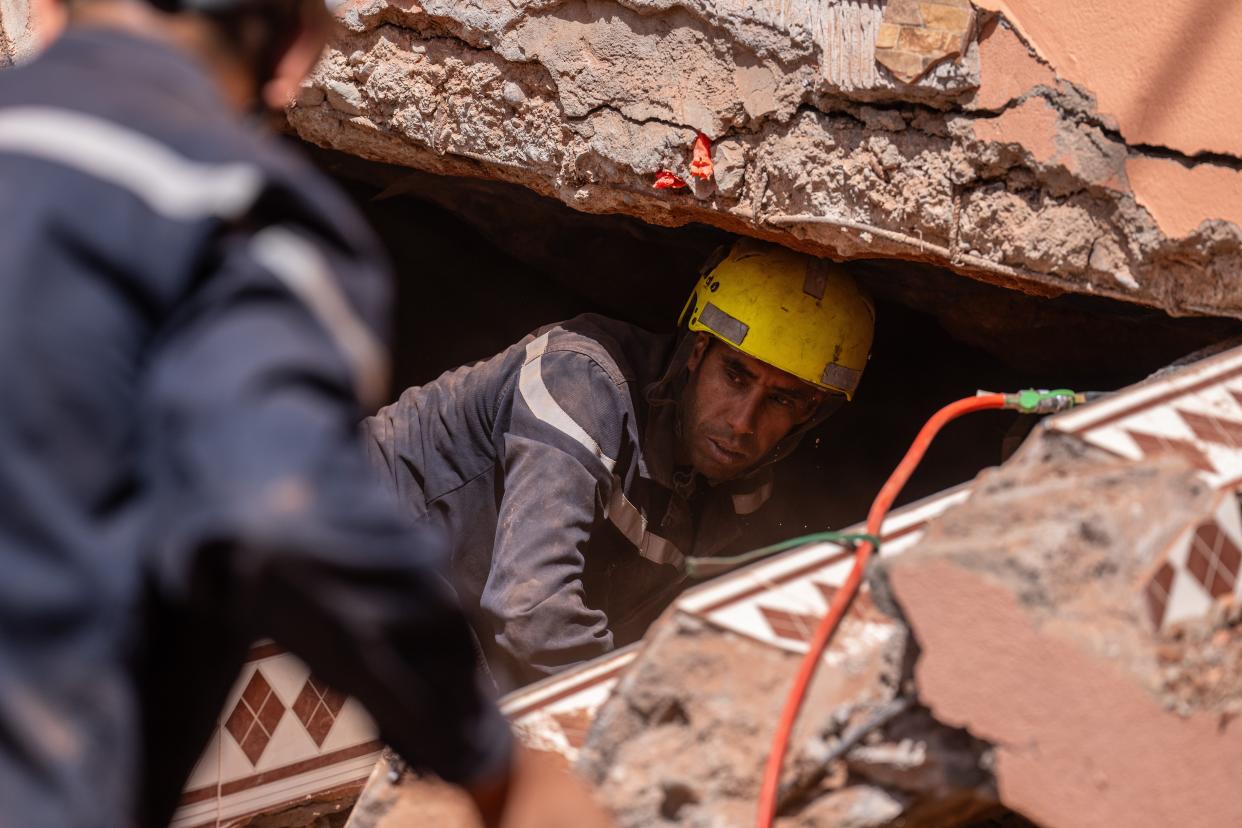 MOULAY BRAHIM, MOROCCO - SEPTEMBER 10: Emergency workers search beneath a heavily damaged house on September 10, 2023 in Moulay Brahim, Morocco. An earthquake measuring 6.8 on the Richter scale hit central Morocco. Although the epicenter was in a sparsely populated area of the High Atlas Mountains, the effects have been felt 71km away in Marrakesh, a major tourist destination, where many buildings have collapsed and over 2,000 deaths have been reported. (Photo by Carl Court/Getty Images) (Getty Images)