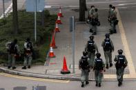 Riot police officers stand guard as a second reading of a controversial national anthem law takes place in Hong Kong