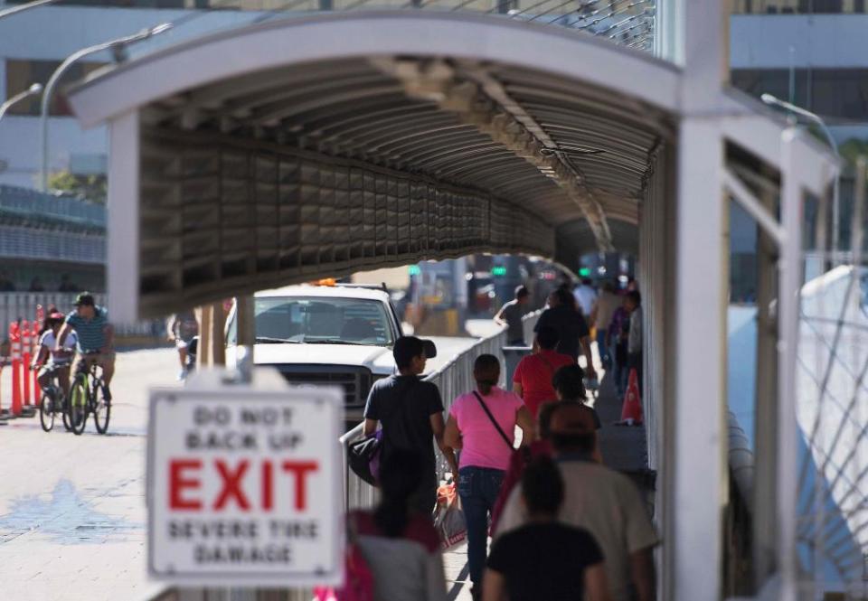 People cross the bridge on the US/Mexico border in Laredo