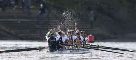 The Oxford women's crew celebrate winning the Oxford versus Cambridge University boat race on the Thames in London, April 11. 2015. REUTERS/Stefan Wermuth