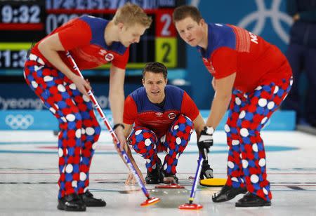 Curling - Pyeongchang 2018 Winter Olympics - Men’s Round Robin - Norway v South Korea - Gangneung Curling Center - Gangneung, South Korea - February 16, 2018 - Skip Thomas Ulsrud of Norway watches as team mates Christoffer Svae and Haavard Vad Petersson sweep. REUTERS/Phil Noble