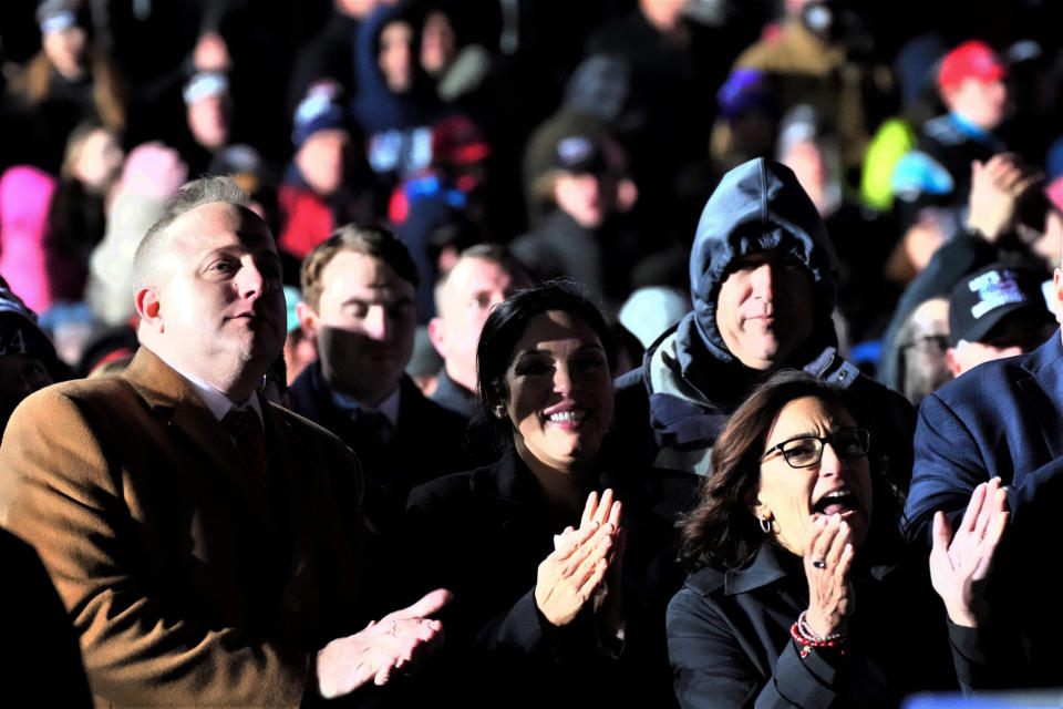 State Rep. Russell Fry, left, and former state Rep. Katie Arrington, right, cheer as former President Donald Trump holds a rally, Saturday, March 12, 2022, in Florence, S.C. Trump has endorsed Fry and Arrington in their primary challenges to two sitting House Republicans in neighboring districts who have been critical of him. (AP Photo/Meg Kinnard)