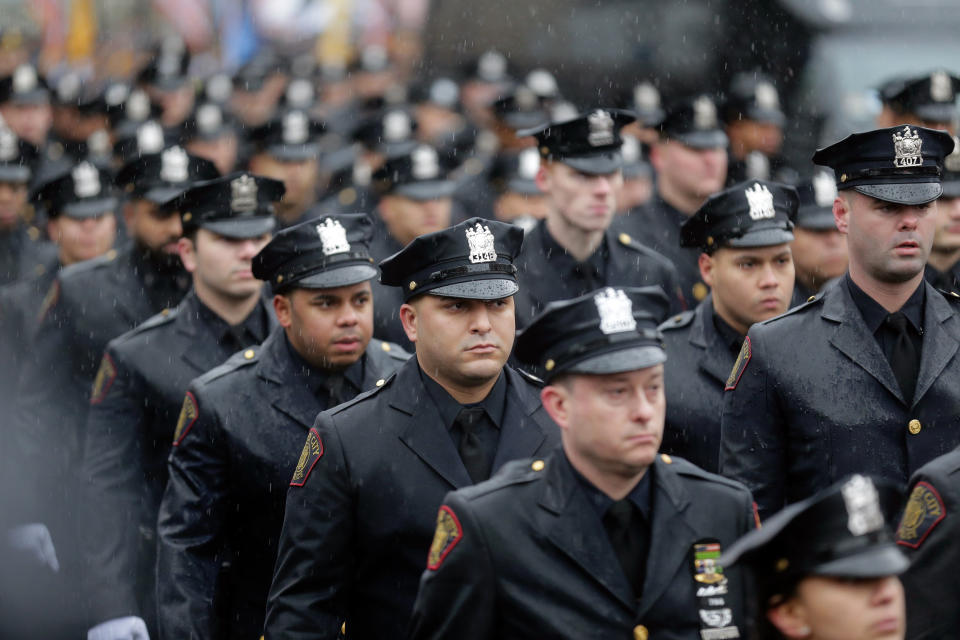 Police officers and other first responders attend the funeral services of Jersey City Police Detective Joseph Seals in Jersey City, N.J., Tuesday, Dec. 17, 2019. The 40-year-old married father of five was killed in a confrontation a week ago with two attackers who then drove to a kosher market and killed three people inside before dying in a lengthy shootout with police. (AP Photo/Seth Wenig)