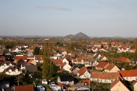 A general views shows Henin-Beaumont with twin slag heaps of a former coal mine site in the background, northern France, April 6, 2017. REUTERS/Pascal Rossignol