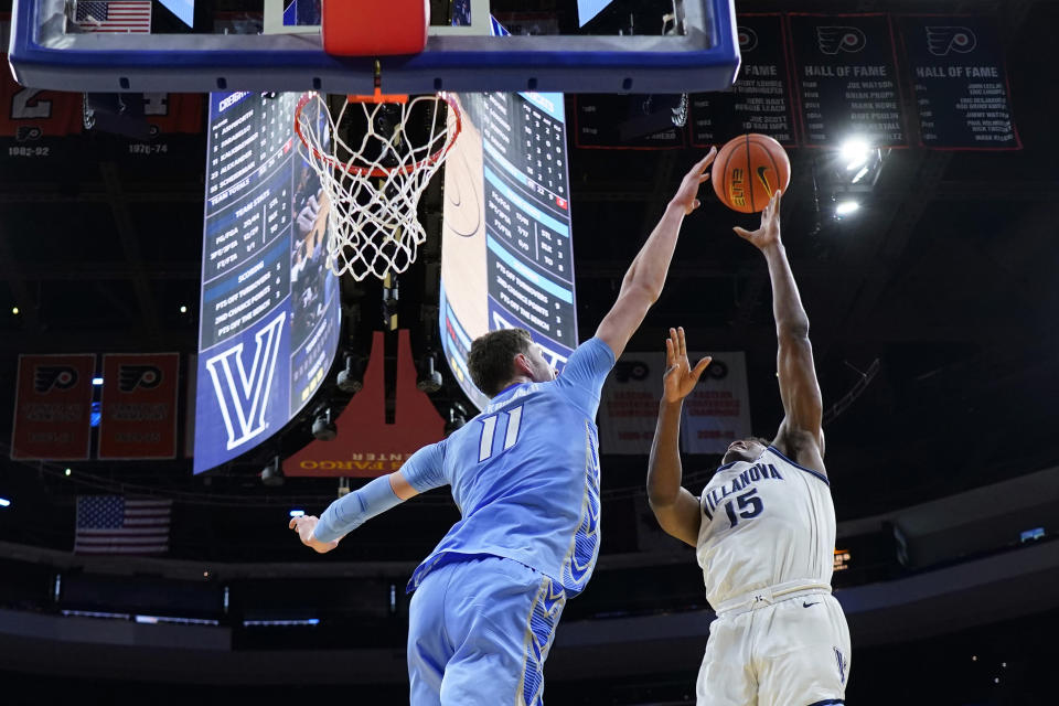 Creighton's Ryan Kalkbrenner (11) blocks a shot by Villanova's Jordan Longino (15) during the second half of an NCAA college basketball game, Saturday, March 9, 2024, in Philadelphia. (AP Photo/Matt Slocum)