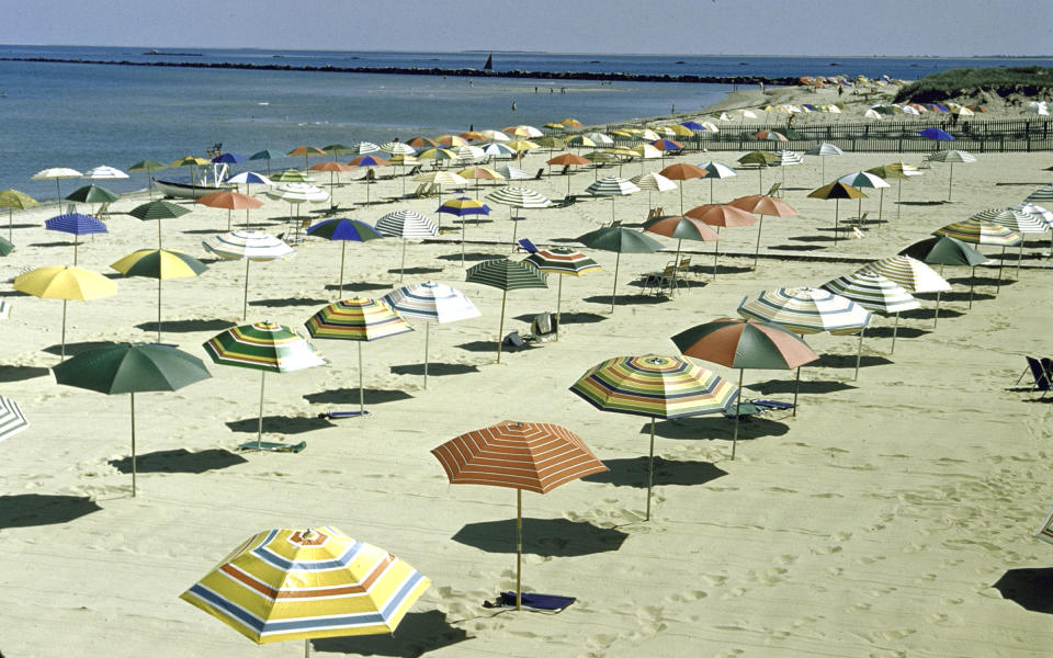 Uniform rows of colorful beach umbrellas await beachgoers in Nantucket in 1957.
