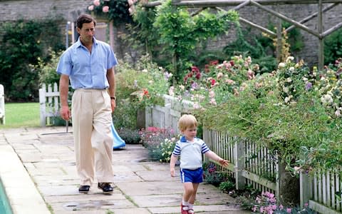 Prince Charles encourages Prince Harry in the Highgrove garden - Credit: Tim Graham