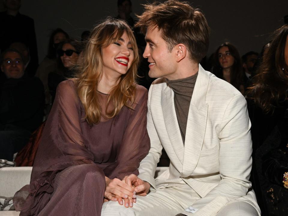 Suki Waterhouse and Robert Pattinson attend the Dior Fall 2023 Menswear Show on December 03, 2022 in Giza, Egypt.