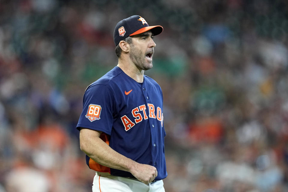 Houston Astros starting pitcher Justin Verlander reacts after a diving fielding play by second baseman Jose Altuve during the seventh inning of a baseball game against the Miami Marlins Sunday, June 12, 2022, in Houston. (AP Photo/David J. Phillip)