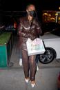 <p>Rihanna holds onto a gift while arriving in N.Y.C.'s Meatpacking District on Monday. </p>