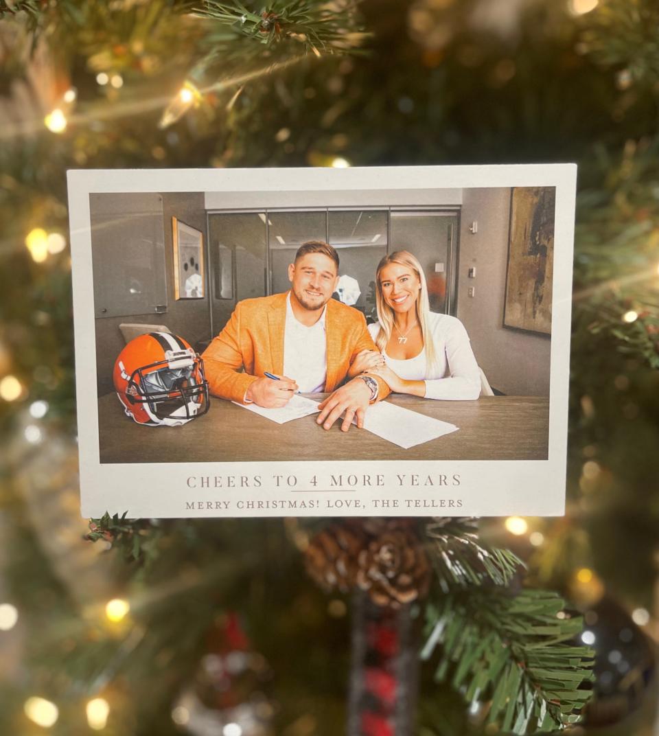 Carly and Wyatt Teller used this photograph of the Browns right guard signing a contract extension to make Christmas cards in 2021. Carly sent the cards to about 1,000 fans last year.