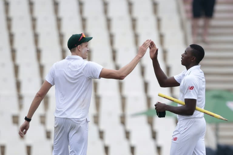 South Africa bowlers Kagiso Rabada (R) and Morne Morkel celebrate after winning the fourth Test at SuperSport Park in Centurion on January 26, 2016