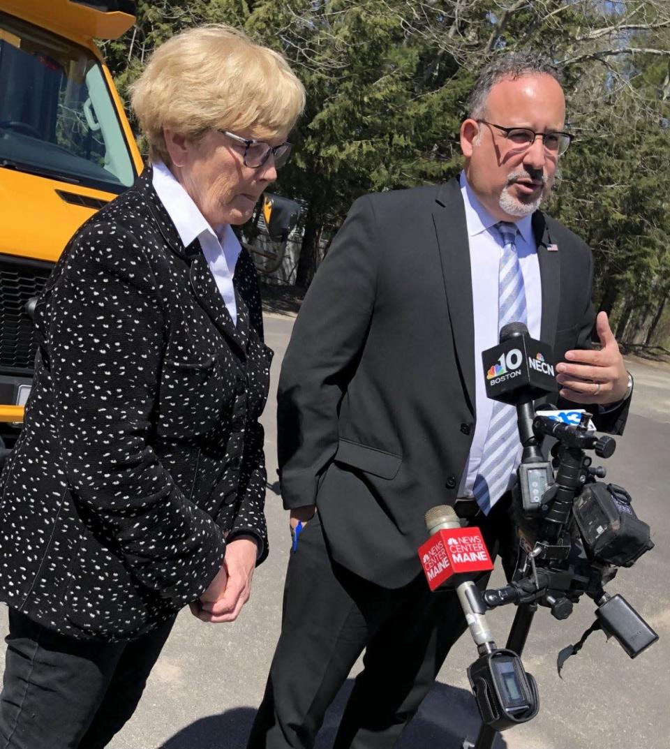 U.S. Education Secretary Dr. Miguel Cardona,
 right, and U.S. Rep. Chellie Pingree discuss school district transportation with the local press during a visit to RSU 21 in Kennebunk on Monday, April 11, 2022.