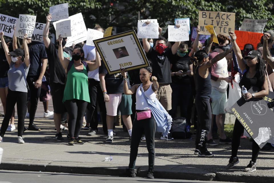 Kelly Bundy participates in a protest over the deaths of George Floyd and Breonna Taylor, Monday, June 1, 2020, in Louisville, Ky. Bundy of Louisville says most protesters are like her, peaceful people called to duty by experiences of racism and police aggression. (AP Photo/Darron Cummings)