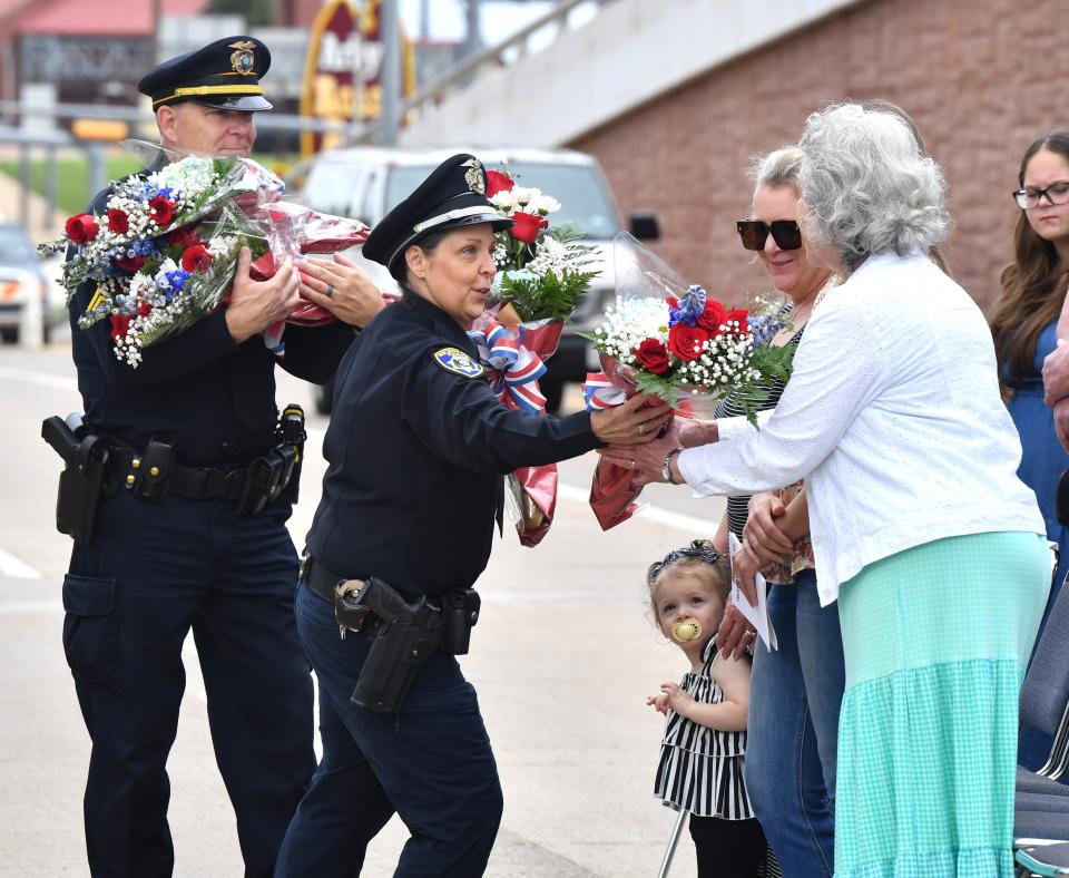 Flowers are given to families of fallen officers during the Wichita Falls Police Memorial Service on Monday.