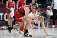 Belgium's Billie Massey fights for a loose ball with China's Meng Li, right, during a women's basketball preliminary round game at the 2020 Summer Olympics, Monday, Aug. 2, 2021, in Saitama, Japan. (AP Photo/Charlie Neibergall)