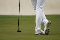 CORRECTS SPELLING OF NAME TO SI, NOT IS - Si Woo Kim, of South Korea, leans on his 3 wood which he had to use to putt on the 16th green during the second round of the Masters golf tournament on Friday, April 9, 2021, in Augusta, Ga. (AP Photo/Matt Slocum)