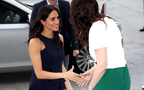 The Duchess of Sussex shakes hands with New Zealand Prime Minister Jacinda Ardern - Credit: AFP